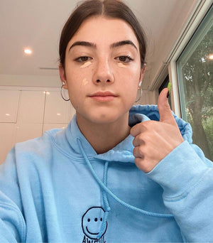 TikToker Charli D’amelio Wearing Awful Cloth Blue Smiley Hoodie